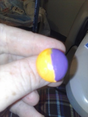 one of the finished rings that has orange and purple polish